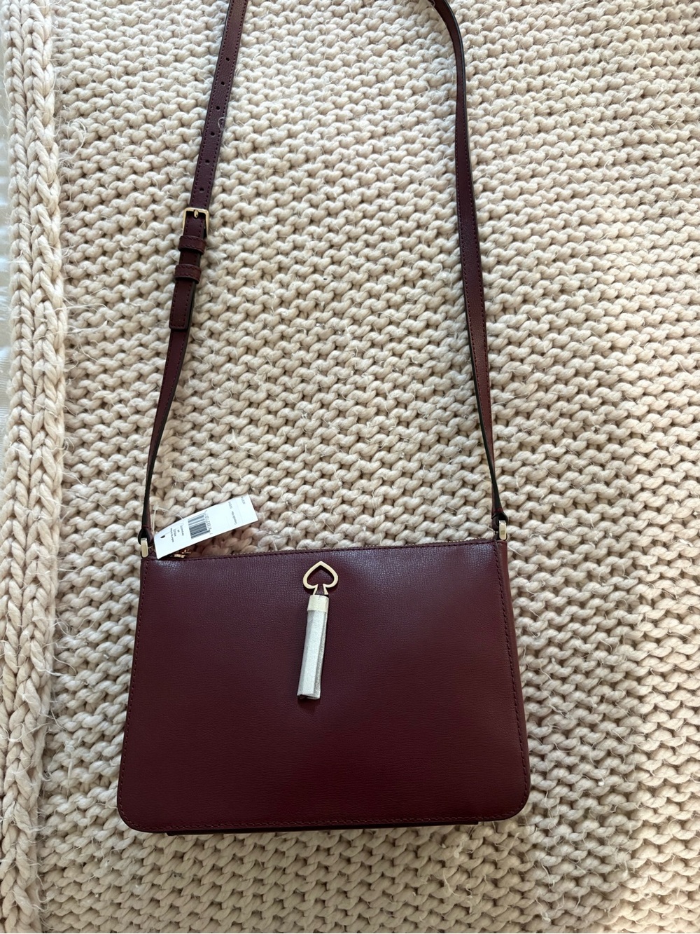 kate spade Burgundy Crossbody Bag with Gold Heart Tassel